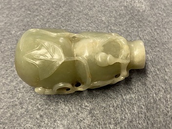 A Chinese gourd-shaped celadon and russet jade snuff bottle, Qing
